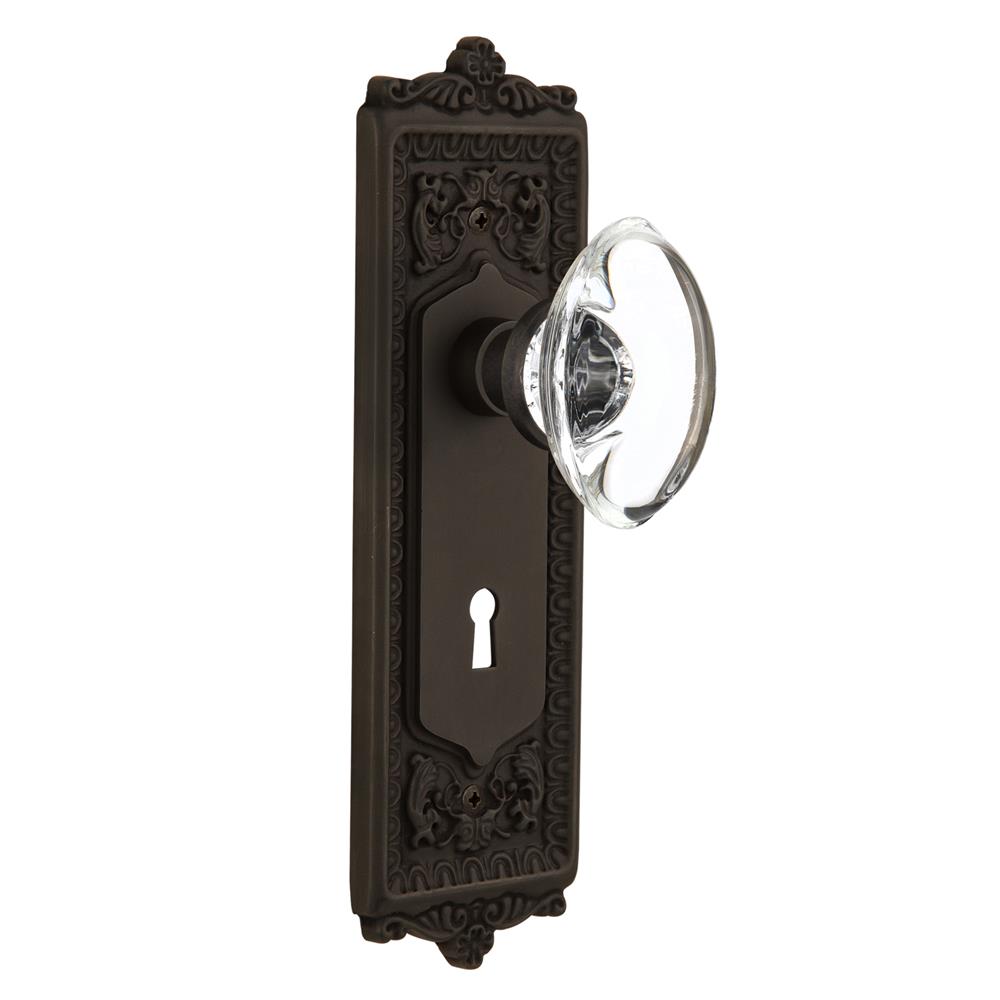 Nostalgic Warehouse EADOCC Passage Knob Egg and Dart Plate with Oval Clear Crystal Knob with Keyhole in Oil Rubbed Bronze